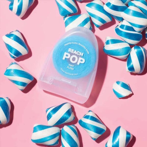 REACH POP fil dentaire menthe - fil dentaire végétalien ciré avec 384 microfils & emballage durable, 50m. Image mint candy flavor.